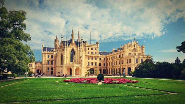 A beautiful castle with a garden and a park. Lednice - Czech Republic - South Moravia. A popular tourist spot for travel and excursions. Landscape with nature in summer time.