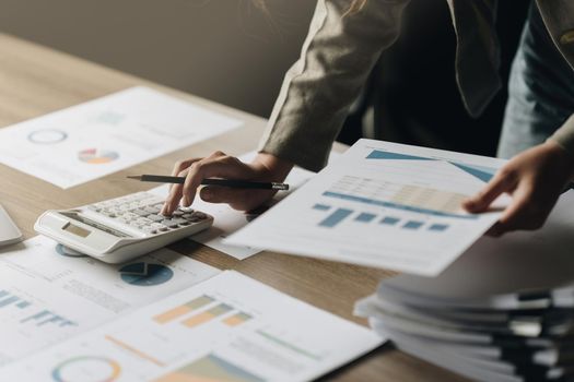 Businesswoman calculating bills, taxes and saving account balance. Finance concept.