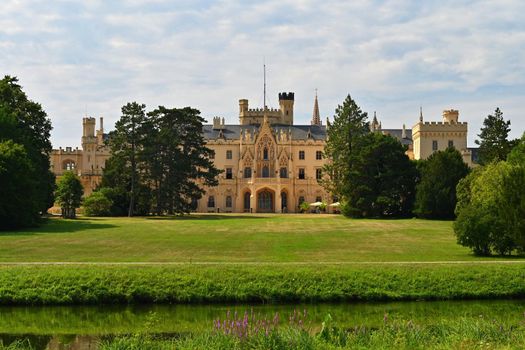 A beautiful castle with a garden and a park. Lednice - Czech Republic - South Moravia. A popular tourist spot for travel and excursions. Landscape with nature in summer time.