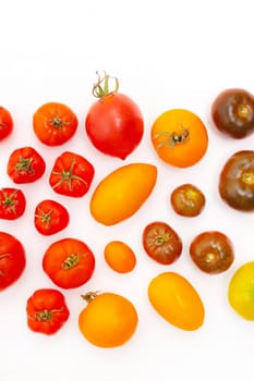 Assorted tomatoes on a white background . Tomatoes copyspace . Homemade vegetables . Article about vegetables