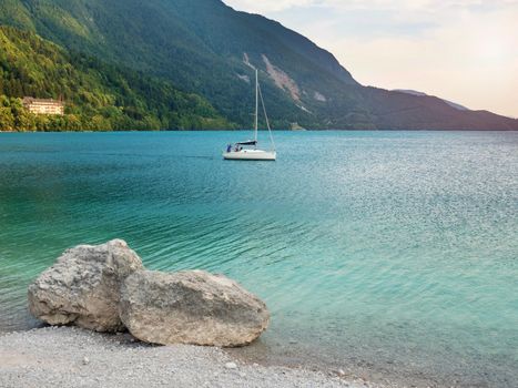 Sale boator yacht   in Molveno lake in Dolomites, Italy