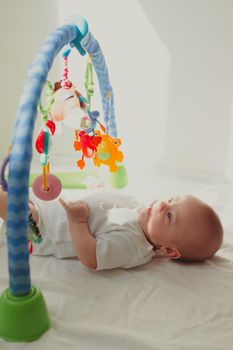 Baby and toys on the arc . Educational toys for kids. Games for children. Article about children lifestyle