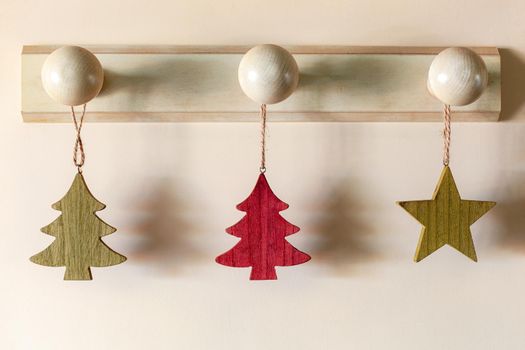 Christmas tree and star form wooden interior suspended decoration, zero waste idea, minimalism