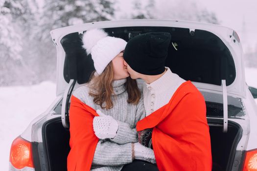 A couple in love in the trunk of a car lifestyle , An article about couples in love. An article about winter . Valentine's day. Love