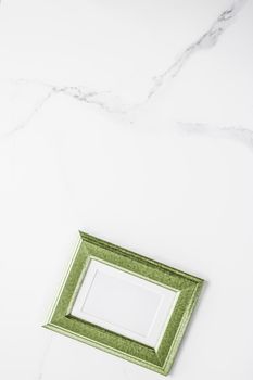 Modern feminine, artwork mock up, luxury design concept. Decorate with chic and style - Green photo frame on marble, flatlay