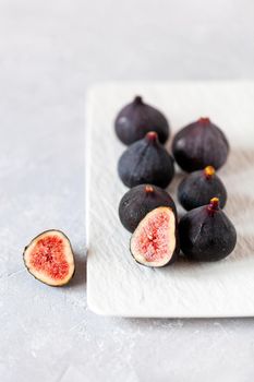 fresh ripe figs on a square plate, side view