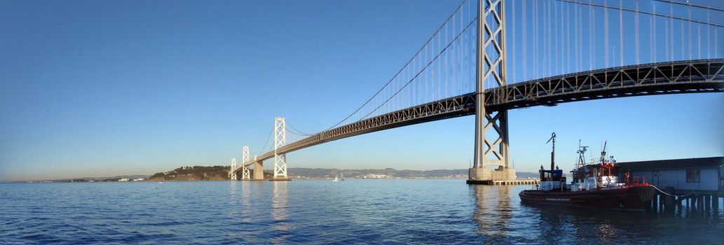 San Francisco - December 23, 2009:  Fireboat docked in front of the San Francisco-Oakland Bay Bridge looking towards the east bay on a nice day.