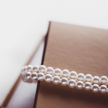 Valentine's day ideas, luxury shopping and holiday inspiration concept - Pearl jewellery in a vintage golden gift box