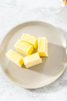 Ingredients in glass mixing bowls to bake s'mores cupcakes.