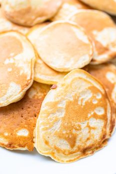 Freshly made small pancakes on a kefir base.