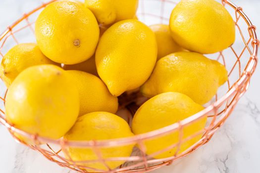 Ingredients in glass mixing bowls to prepare lemon bundt cake.