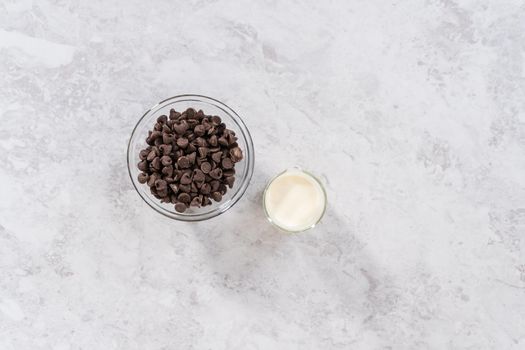 Flat lay. Preparing chocolate ganache to bake s'mores cupcakes.