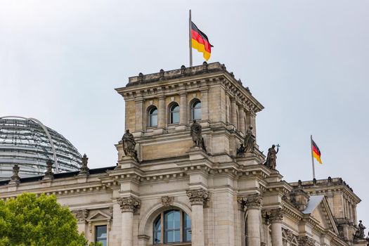 Tower from Reichstag with German flag in German capital Berlin, Germany