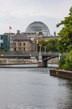 The Spree with bridge and in the background the Reichstag with dome, Berlin, Germany