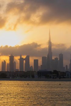 Dubai, UAE - 03.06.2021 Dubai public beach with city skyline on background.Sunrise hour