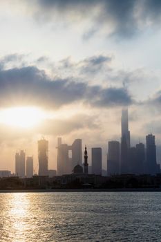 Dubai, UAE - 03.06.2021 Dubai public beach with city skyline on background.Sunrise hour