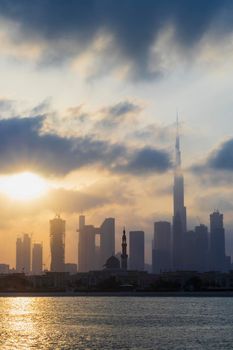 Dubai, UAE - 03.06.2021 Dubai public beach with city skyline on background.Sunrise hour