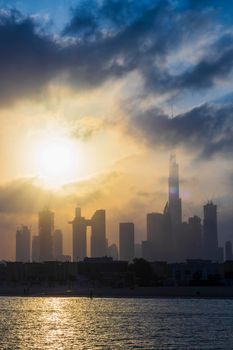 Dubai, UAE - 03.06.2021 Dubai public beach with city skyline on background.Sunrise hour