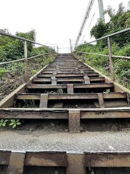 Close up of rusty old metal stairway