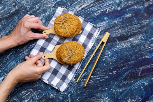 Oatmeal cookies from a plate. Top view. Craft homemade food. View from above. Black background