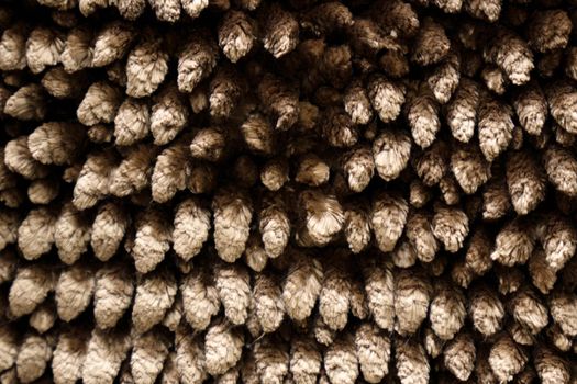 Fuzzy brown for plaid. Shaggy blanket background. Fluffy fake textile fur. Selective focus