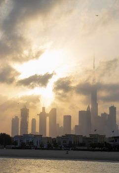 Dubai, UAE - 03.06.2021 Dubai public beach with city skyline on background.Sunrise hour