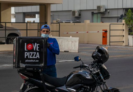 Dubai, UAE - 08.03.2021 - Delivery boy in Deira area