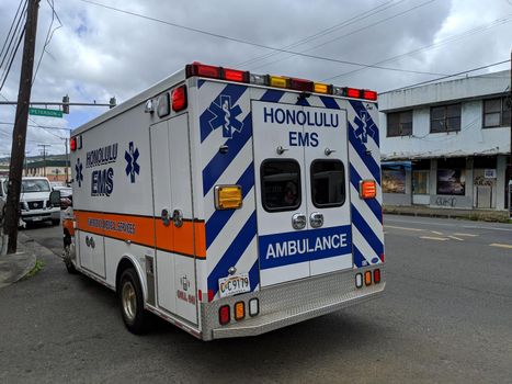 Honolulu - August 5, 2020: Emergency Medical Services (EMS) Paramedic Unit Ambulance parked in intersection..