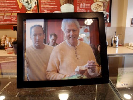 San Francisco - August 25, 2009:  Bill Clinton eating ice cream photo on display inside ice cream store.