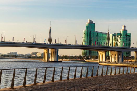 Dubai, UAE - 04.17.2021 Business bay crossing bridge and Al Futtaim company head quarters