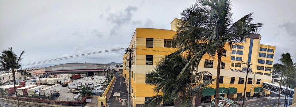 Honolulu, Hawaii - December 28, 2021: Panoramic Aerial view of The Dole Cannery building and DHL Shipping center on island of Oahu.  Formerly a canning complex it is now an office and retail complex that offers specialty shops, superstores, entertainment, eateries, and service providers: tenants, leasing and meeting facility information.  