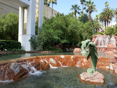 Las Vegas, Nevada - June 29, 2015: Waterfall featuring dolphins at The Volcano at The Mirage hotel.