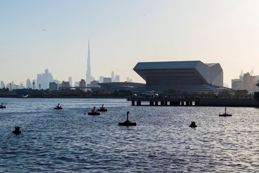 Dubai, UAE - 04.17.2021 New building of Sheikh Muhammad Bin Rashid library and tallest building in the world Burj Khalifa on background.