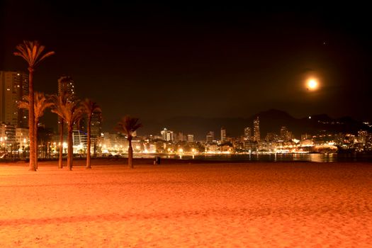 Benidorm, Alicante, Spain- September 11, 2022: Beautiful panoramic view of Benidorm town on a full moon night