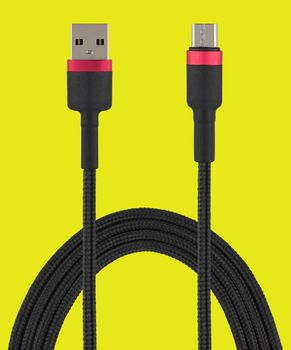 cable with USB and micro USB connector, on a yellow background in isolation