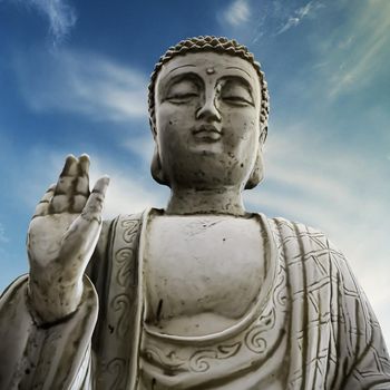 Buddha statue below a blue sky 3d illustration