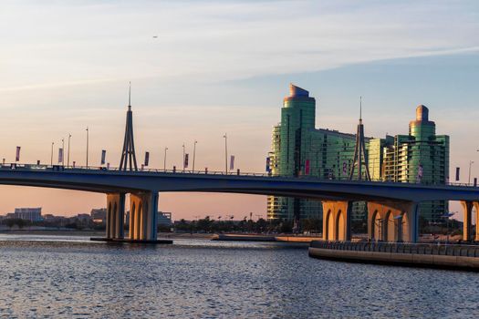 Dubai, UAE - 04.17.2021 Business bay crossing bridge and Al Futtaim company head quarters