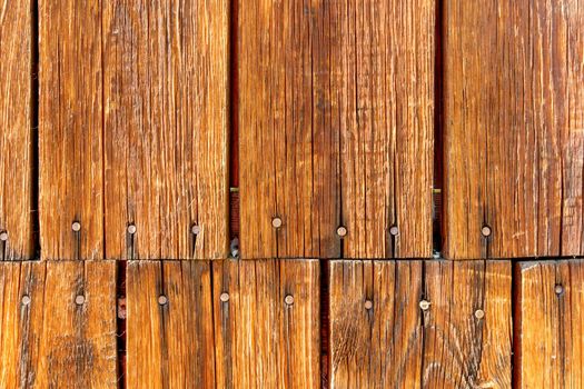 Grunge wood texture. Raw brown wooden wall background. Village building construction.