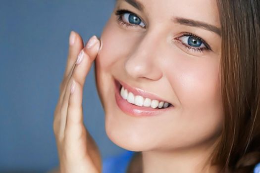 Beauty, skincare and cosmetic product, woman applying anti-aging face cream on her skin, portrait