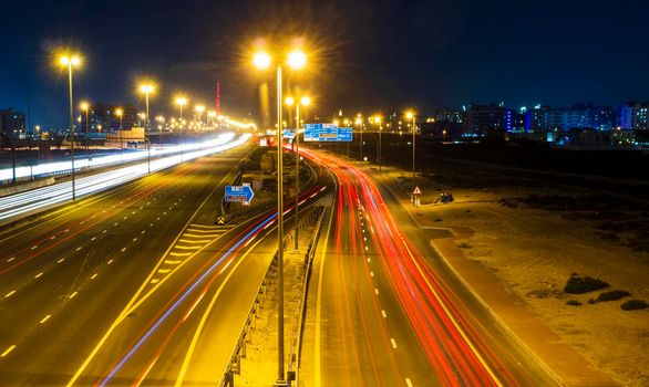 Dubai, UAE - 02.22.2021 Shot of a night road with light trails.