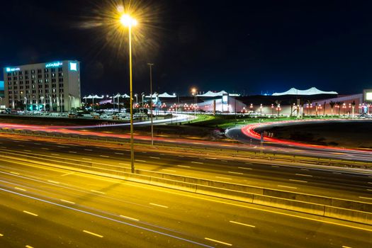 Dubai, UAE - 02.22.2021 Shot of a night road with light trails.