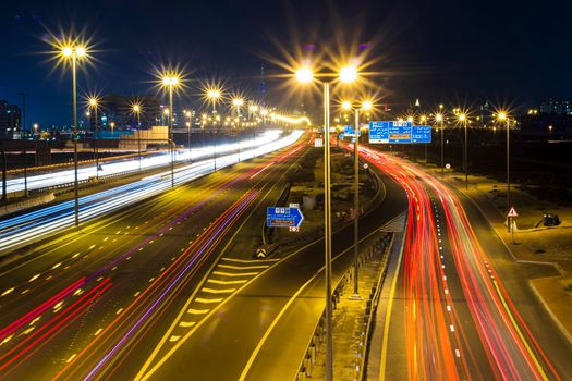 Dubai, UAE - 02.22.2021 Shot of a night road with light trails.