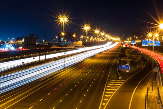 Dubai, UAE - 02.22.2021 Shot of a night road with light trails.