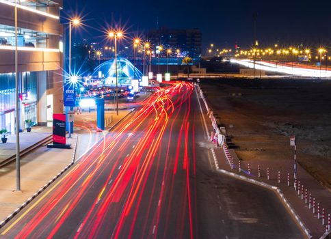 Dubai, UAE - 02.22.2021 Shot of a night road with light trails.