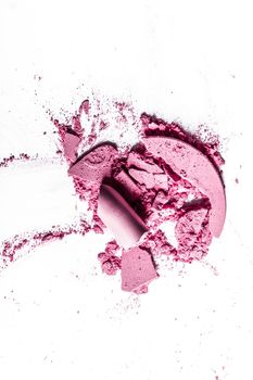 Beauty texture, cosmetic product and art of make-up concept - Crushed eyeshadows, lipstick and powder isolated on white background
