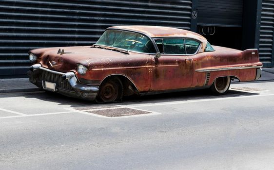 Shot of abandoned, rusty, vintage car.