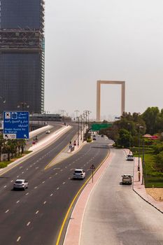 Dubai, UAE - 07.10.2021 Road leading to Dubai frame building