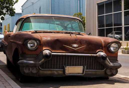 Shot of abandoned, rusty, vintage car.