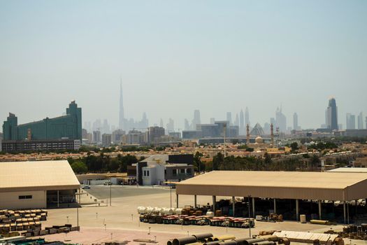 View of not a usual Dubai's skyline with warehouse on foreground. UAE. Outdoors shot