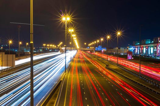 Dubai, UAE - 02.22.2021 Shot of a night road with light trails.